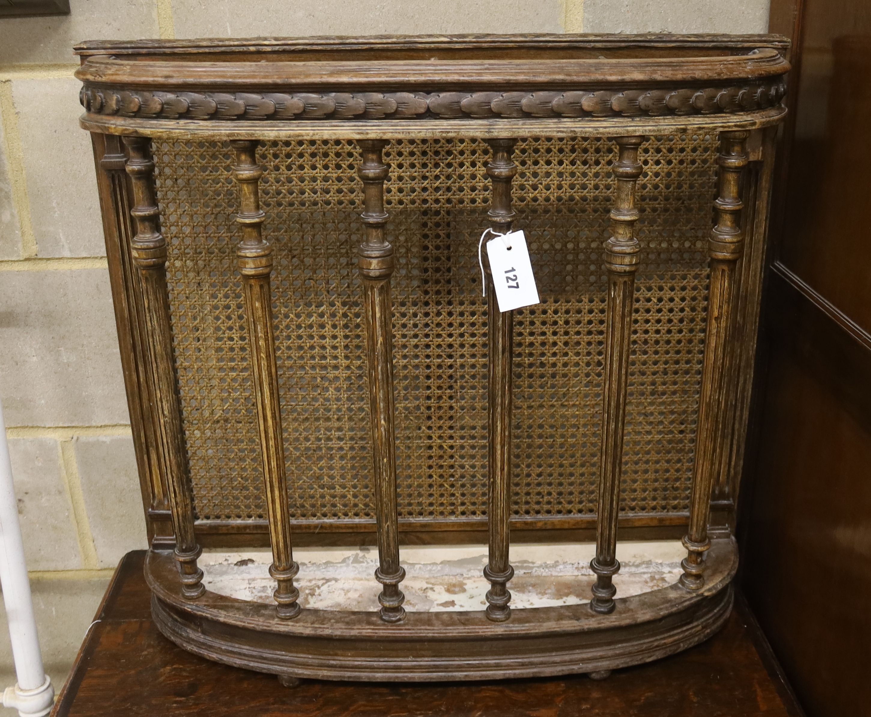An early 20th century caned beech four division stick stand, width 73cm, depth 20cm, height 68cm